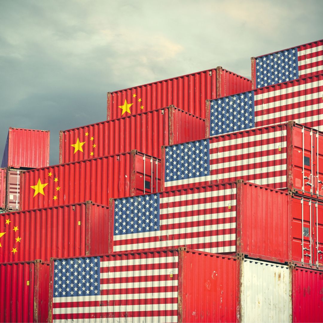 Cargo containers painted with Chinese and U.S. flags.