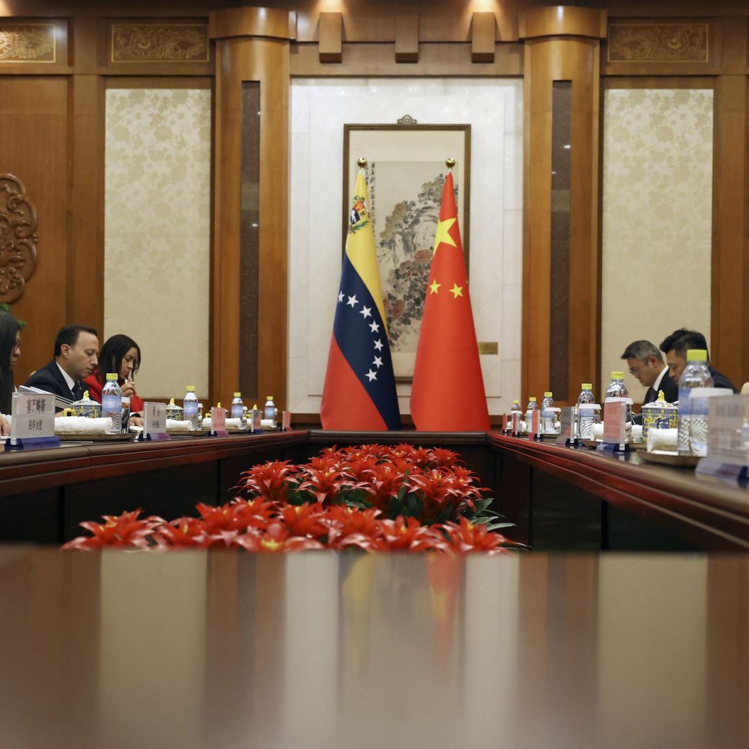 Chinese Foreign Minister Wang Yi (right) and Venezuelan Foreign Minister Yvan Gil (left) attend a meeting in Beijing on May 12, 2025