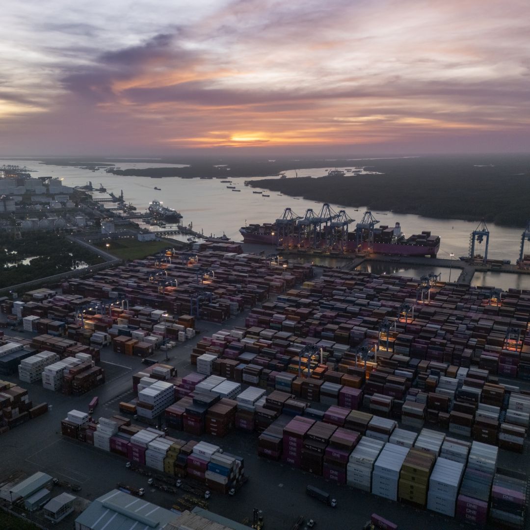 A large container ship is seen docked at a port. A large container ship is seen docked at a port.