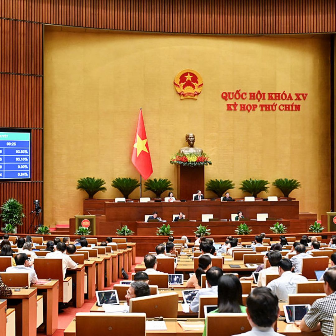 Vietnamese lawmakers vote on a merger of provinces and cities at the National Assembly in Hanoi on June 12, 2025.