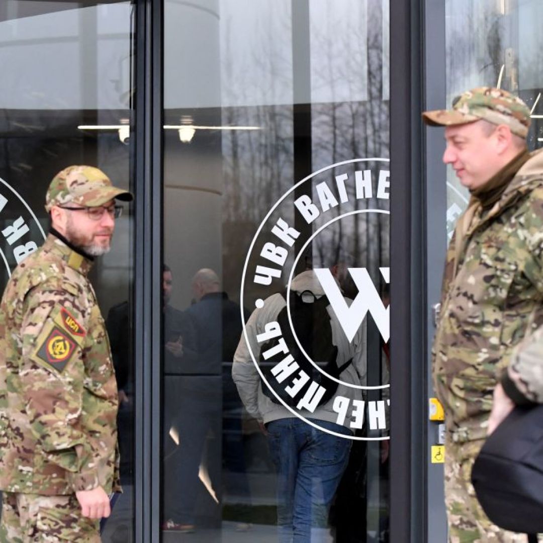 Visitors wearing military camouflage stand at the entrance of the ''PMC Wagner Center,'' which is associated with the founder of the Wagner private military group (PMC), Yevgeny Prigozhin, in Saint Petersburg, Russia, on Nov. 4, 2022. Visitors wearing military camouflage stand at the entrance of the ''PMC Wagner Center,'' which is associated with the founder of the Wagner private military group (PMC), Yevgeny Prigozhin, in Saint Petersburg, Russia, on Nov. 4, 2022.