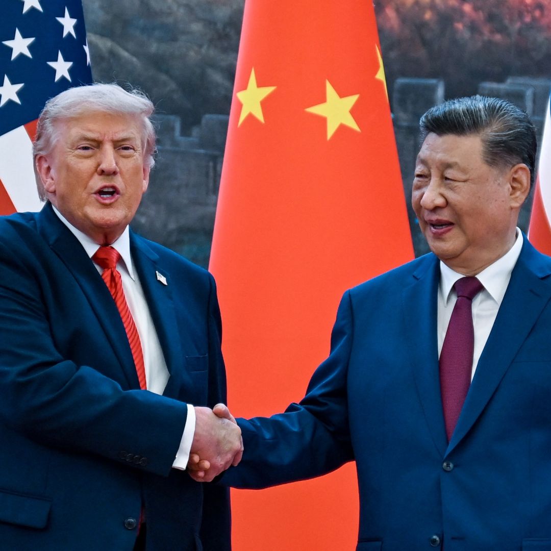 U.S. President Donald Trump (right) shakes hands with Chinese President Xi Jinping at the Great Hall of the People in Beijing on May 14, 2026.