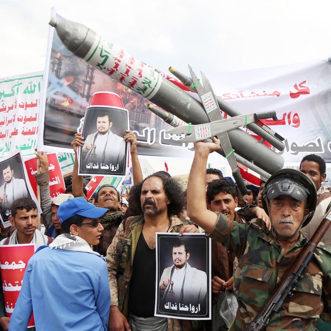 Yemeni protesters take part in a demonstration held to send a message of defiance against the continued siege and any military escalation involving Saudi forces against Houthi-controlled northern Yemen on July 17. 