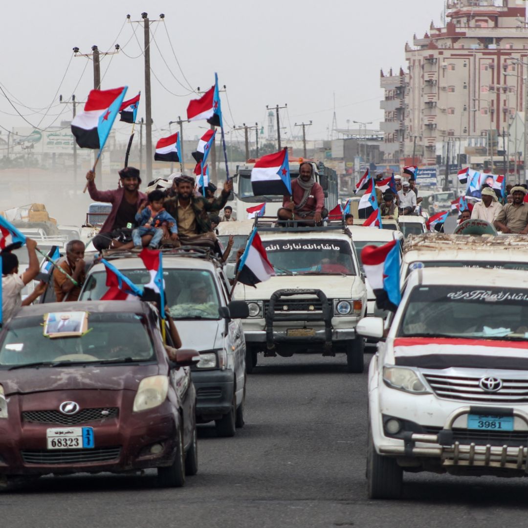 Yemenis gather during a rally to show their support for the UAE-backed Southern Transitional Council (STC), which wants to revive an independent South Yemen, as they wave the old South Yemen flag in Khormaksar Square, in the coastal port city of Aden on Dec. 14, 2025. 