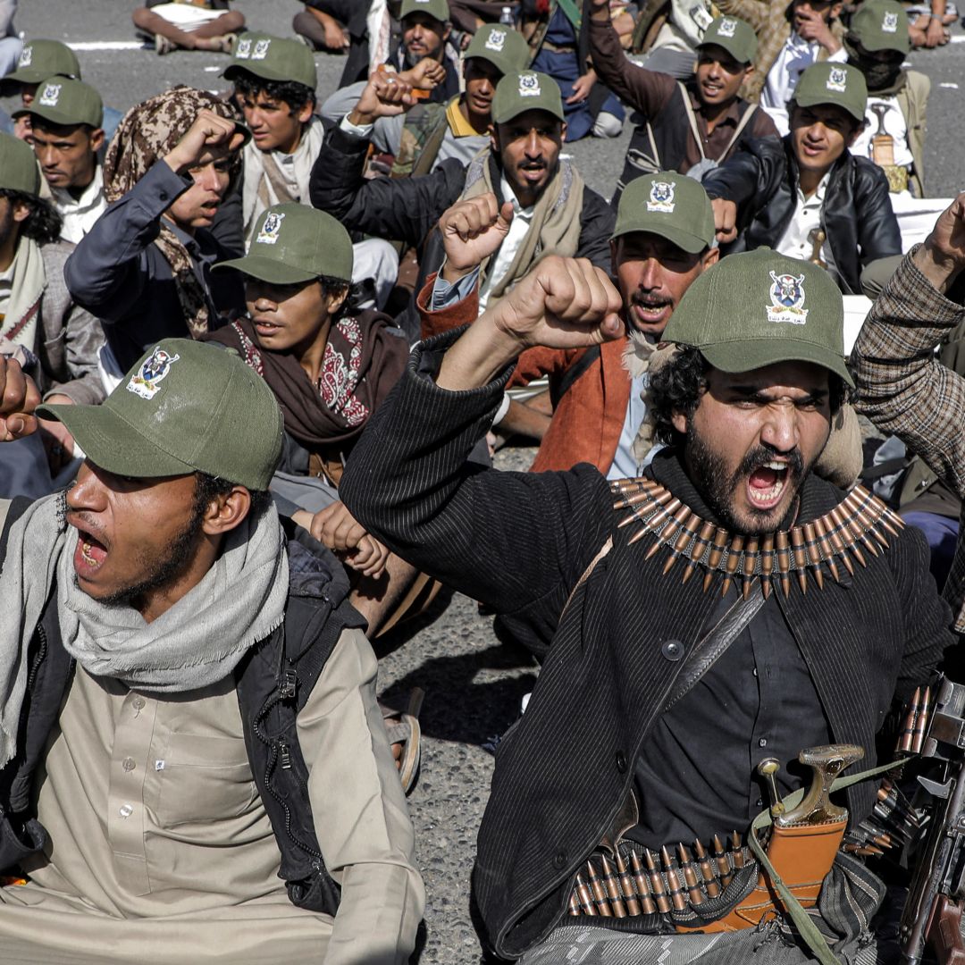 Fighters loyal to Yemen's Houthi group chant in Sanaa, Yemen, on Sept. 21, 2024, during a military parade marking the anniversary of the Houthis’ 2014 takeover of the capital.