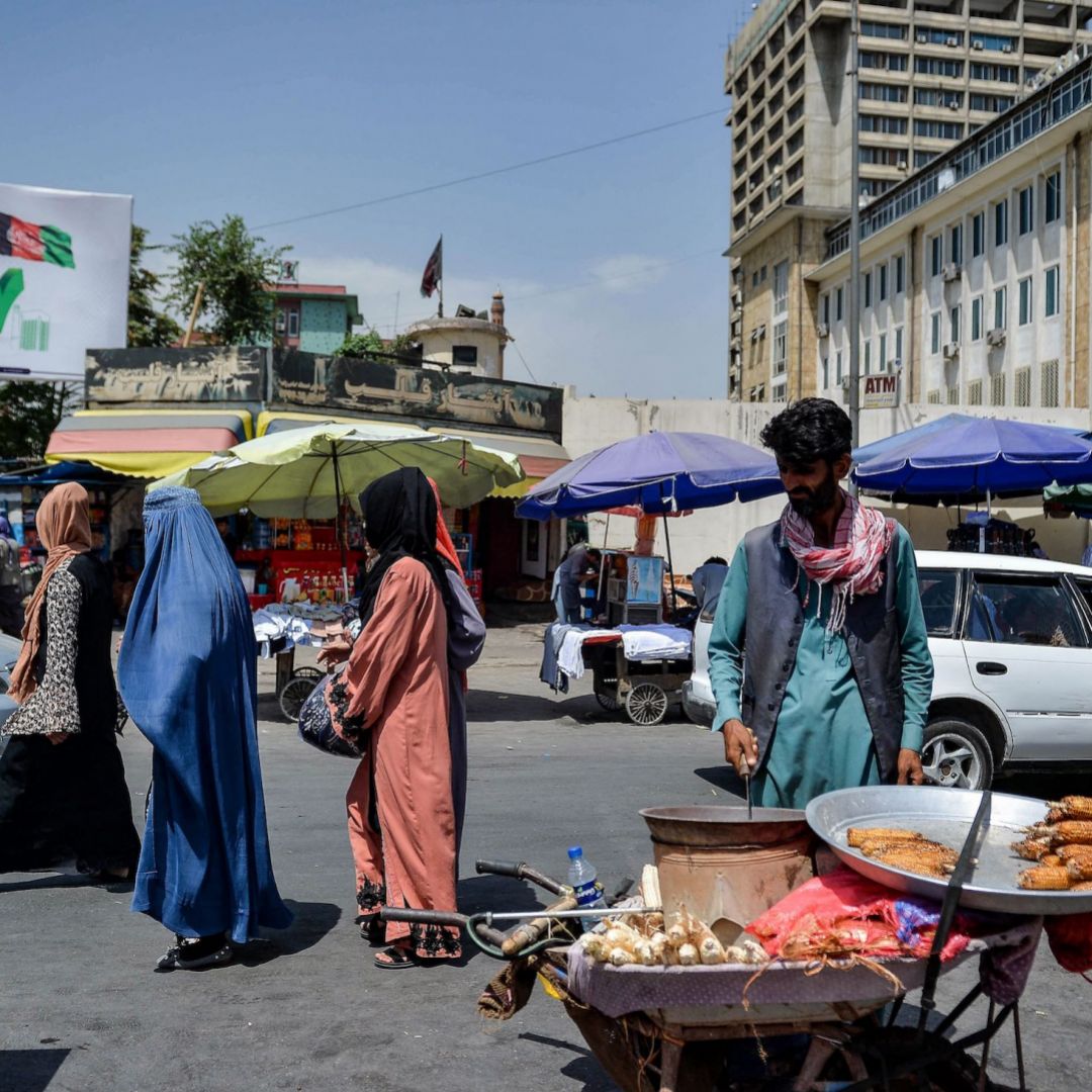 Afghan women shop at a market area in Kabul on Aug. 23, 2021, following the Taliban's takeover of the country.
