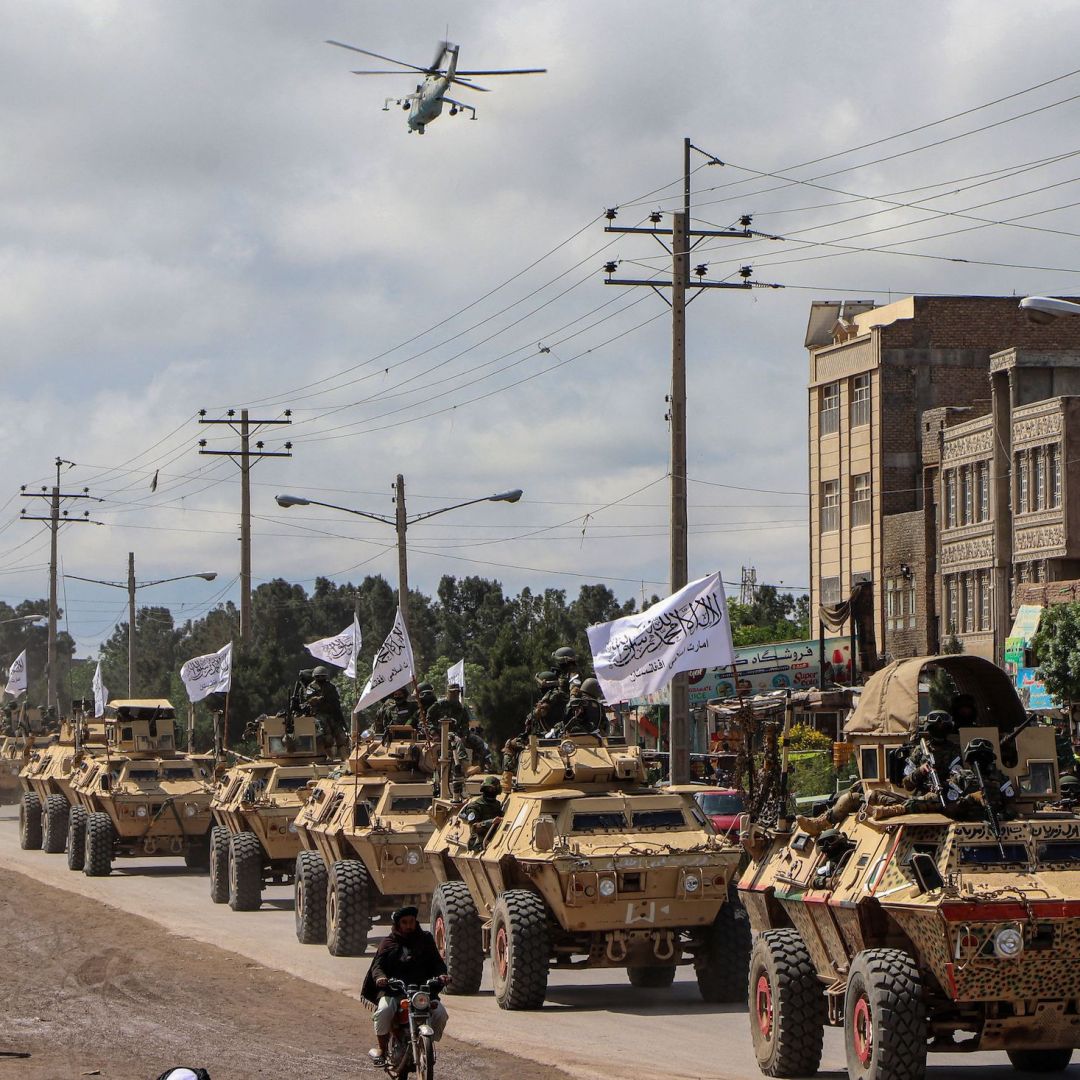 Taliban fighters in armored vehicles in a military parade on April 19, 2022, in Herat, Afghanistan.