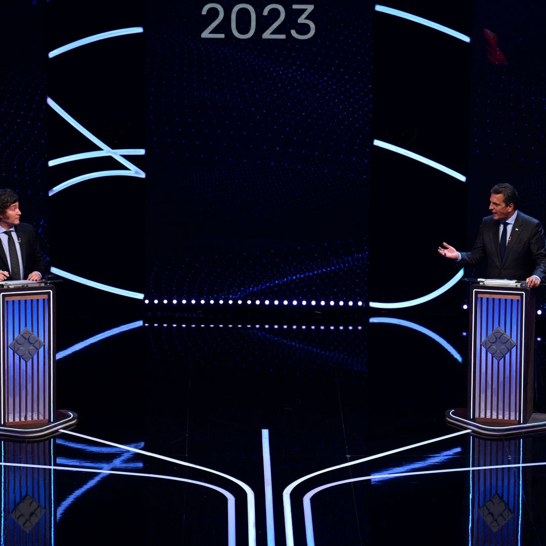 The presidential candidate for the Union por la Patria party, Sergio Massa (R), speaks next to the presidential candidate for the La Libertad Avanza party, Javier Milei, on Nov. 12, 2023, during a presidential debate in Buenos Aires, Argentina.