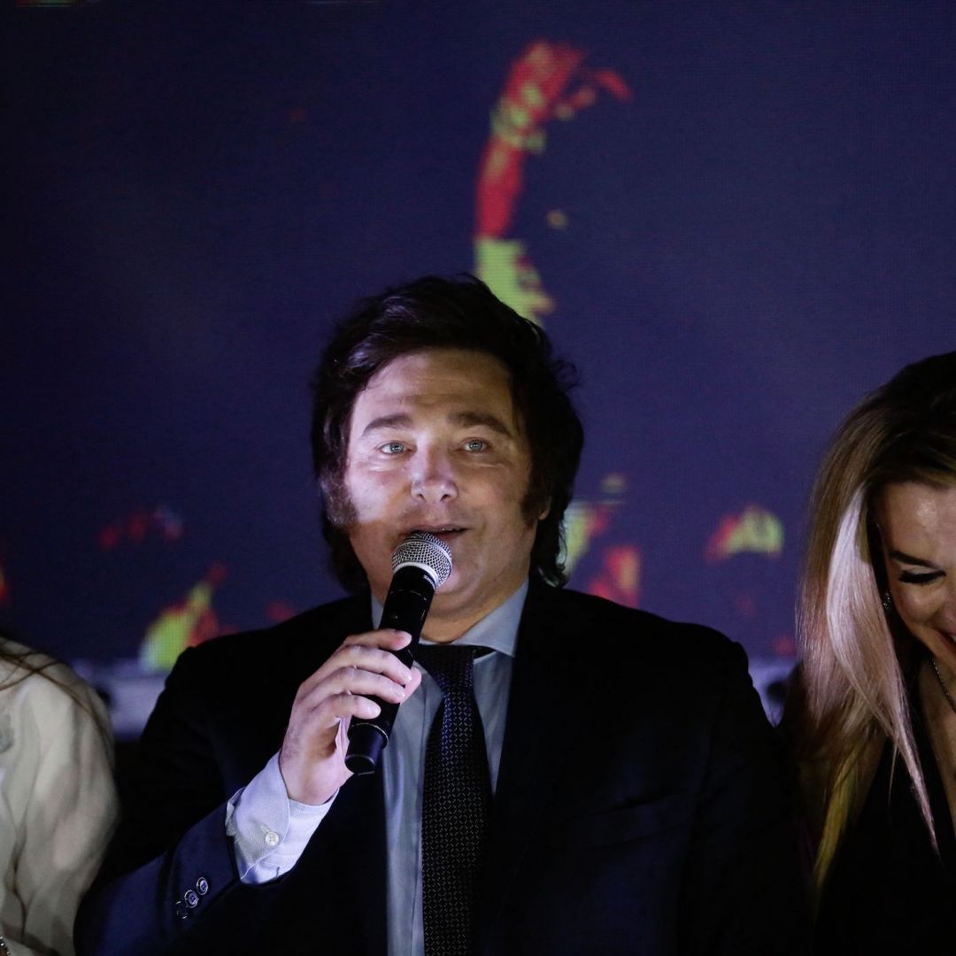 Argentine President-elect Javier Milei (center) speaks to supporters, accompanied by his running mate Victoria Villarruel (left) and his girlfriend Fatima Florez (right) in Buenos Aires, Argentina, after winning the presidential runoff on Nov. 19, 2023. 
