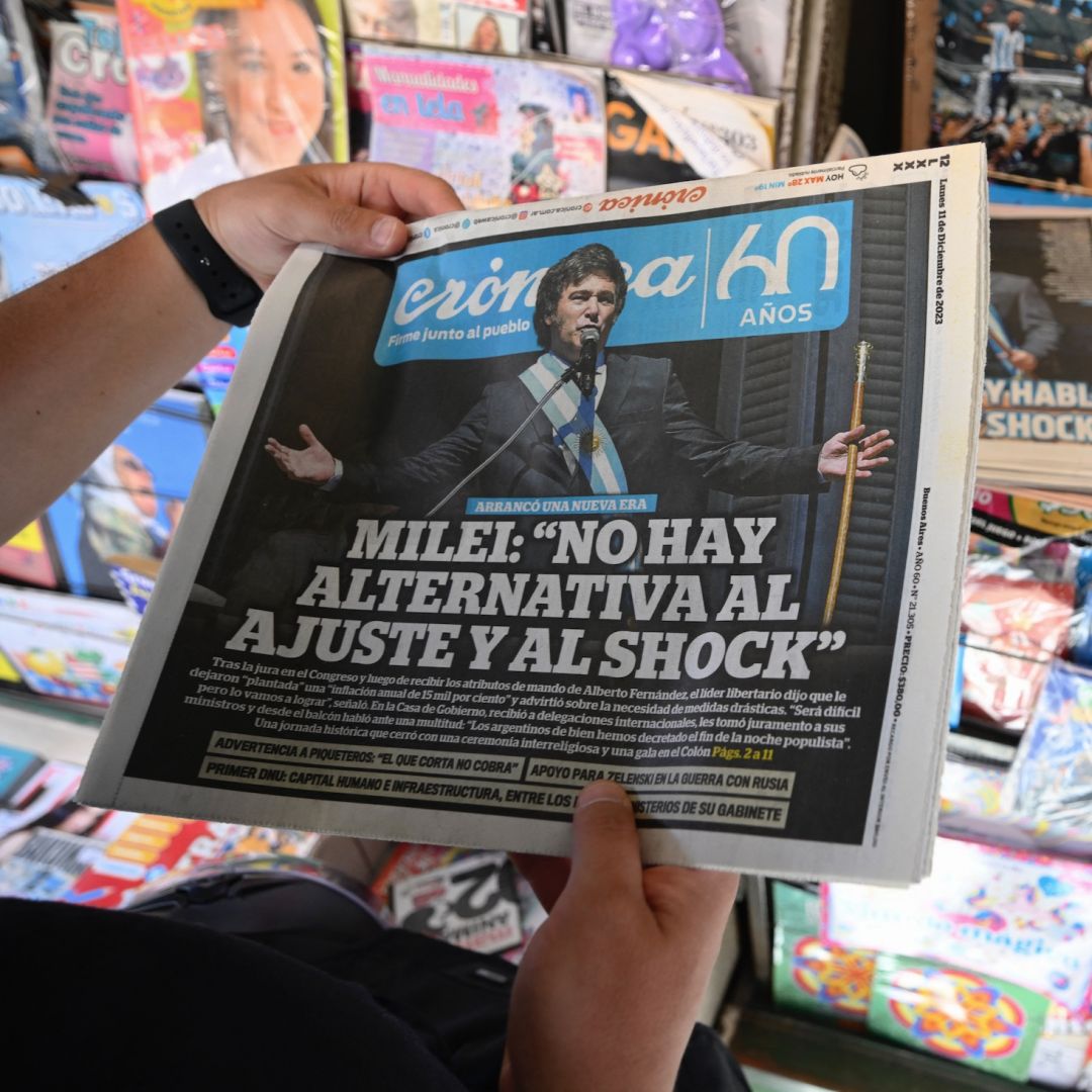 A vendor sells newspapers showing the inauguration of Argentine President Javier Milei on the covers in Buenos Aires, Argentina, on Dec. 11, 2023. 