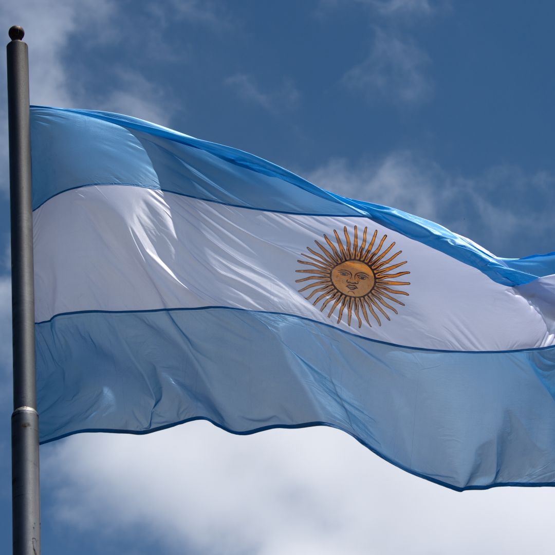 The national flag of Argentina flies above Avenida 9 de Julio, one of the major arteries of Buenos Aires, on Nov. 28, 2018. 