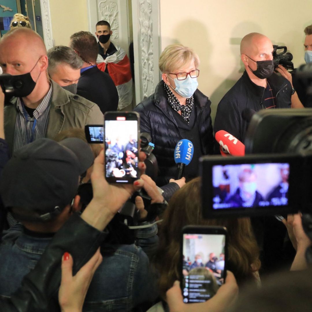 Lithuanian Prime Minister Ingrida Simonyte (center) speaks to journalists in Vilnius on May 23, 2021, about the Ryanair passenger plane that was hijacked and diverted to Minsk, Belarus.