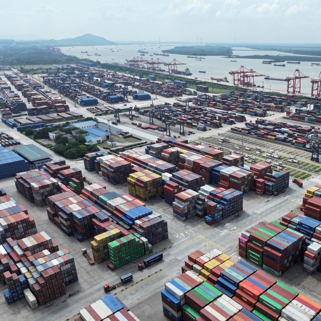 A truck drives between shipping containers at Nanjing port in China's eastern Jiangsu province on Aug. 6, 2023. A truck drives between shipping containers at Nanjing port in China's eastern Jiangsu province on Aug. 6, 2023.