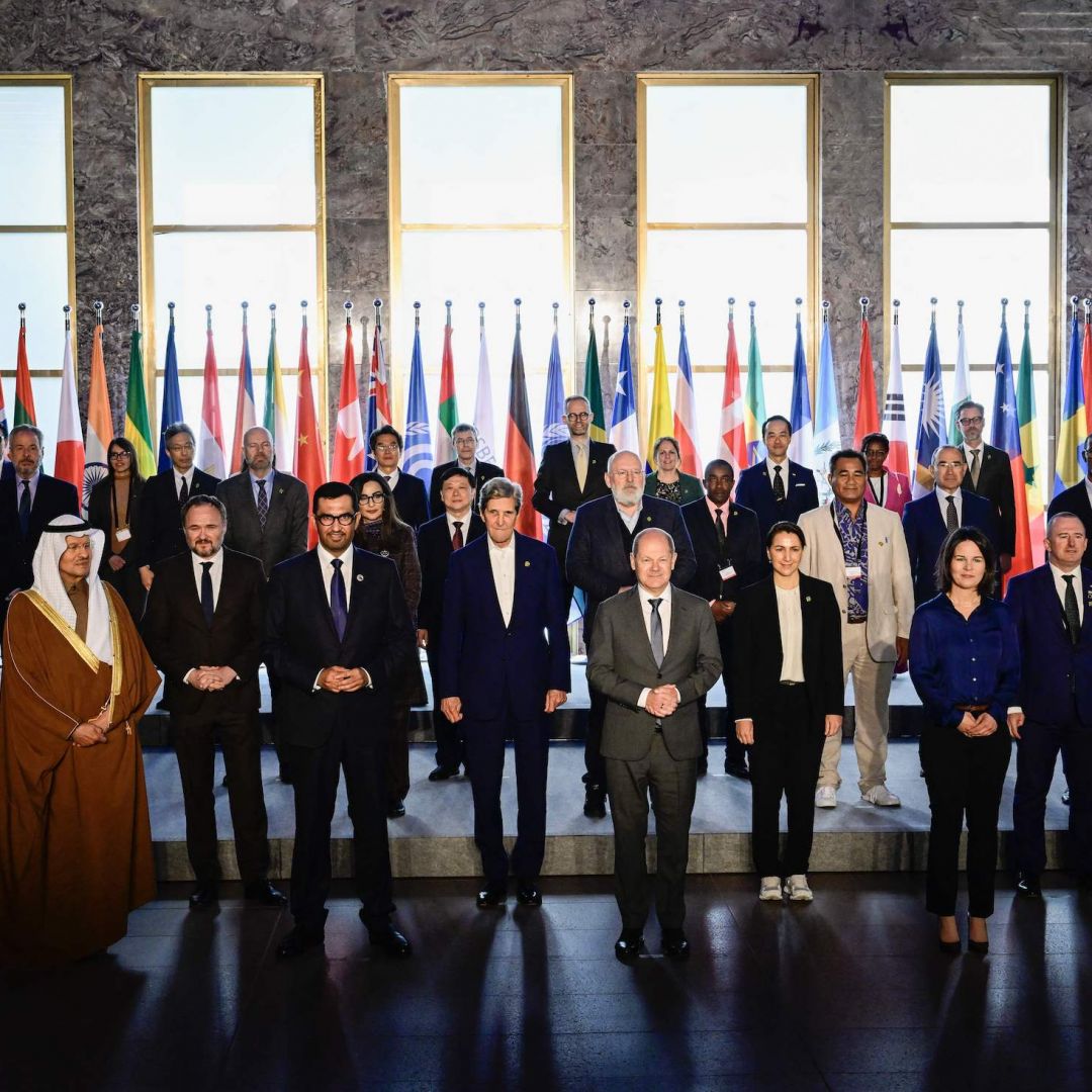 COP28 President-Designate and the UAE's Special Envoy for Climate Change, Sultan al-Jaber (front row, fourth from left) -- poses for a group photo along with U.S. Climate Envoy John Kerry, German Chancellor Olaf Scholz, German Foreign Minister Annalena Baerbock and other participants in the Petersberg Climate Dialogue on May 3, 2023, in Berlin, Germany.