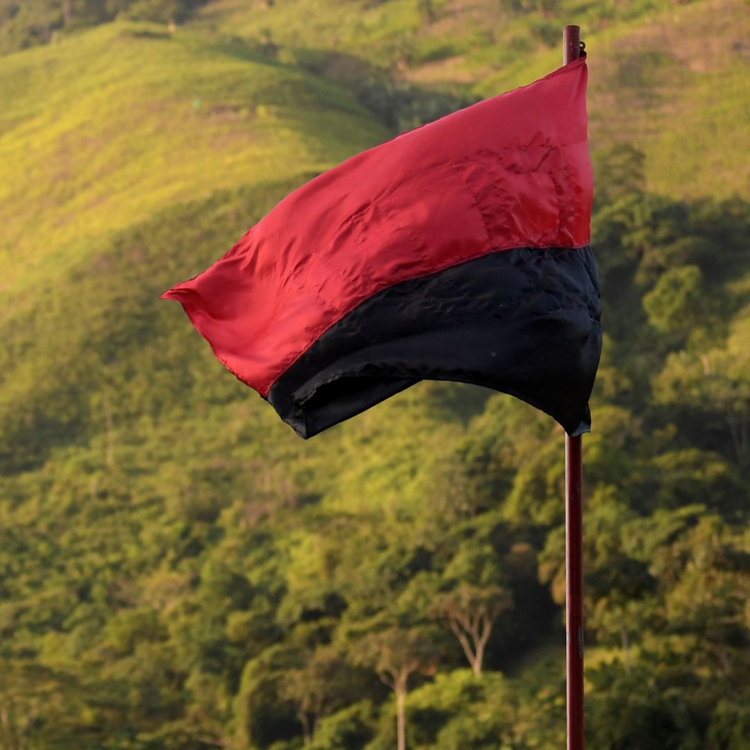A flag of the National Liberation Army (ELN) guerrilla group flutters in the wind in Catatumbo, Colombia, on Aug. 18, 2022. 