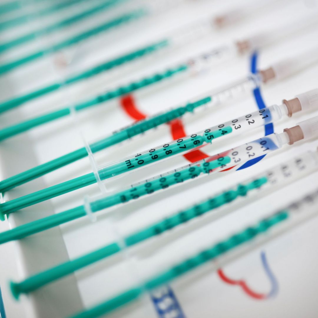 Syringes are seen on a table at a COVID-19 vaccine distribution site in Senftenberg, Germany. 