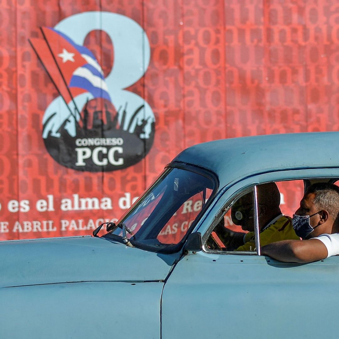 A motorist passes a sign for the 8th Congress of the Cuban Communist Party on April 6, 2021, in Havana.