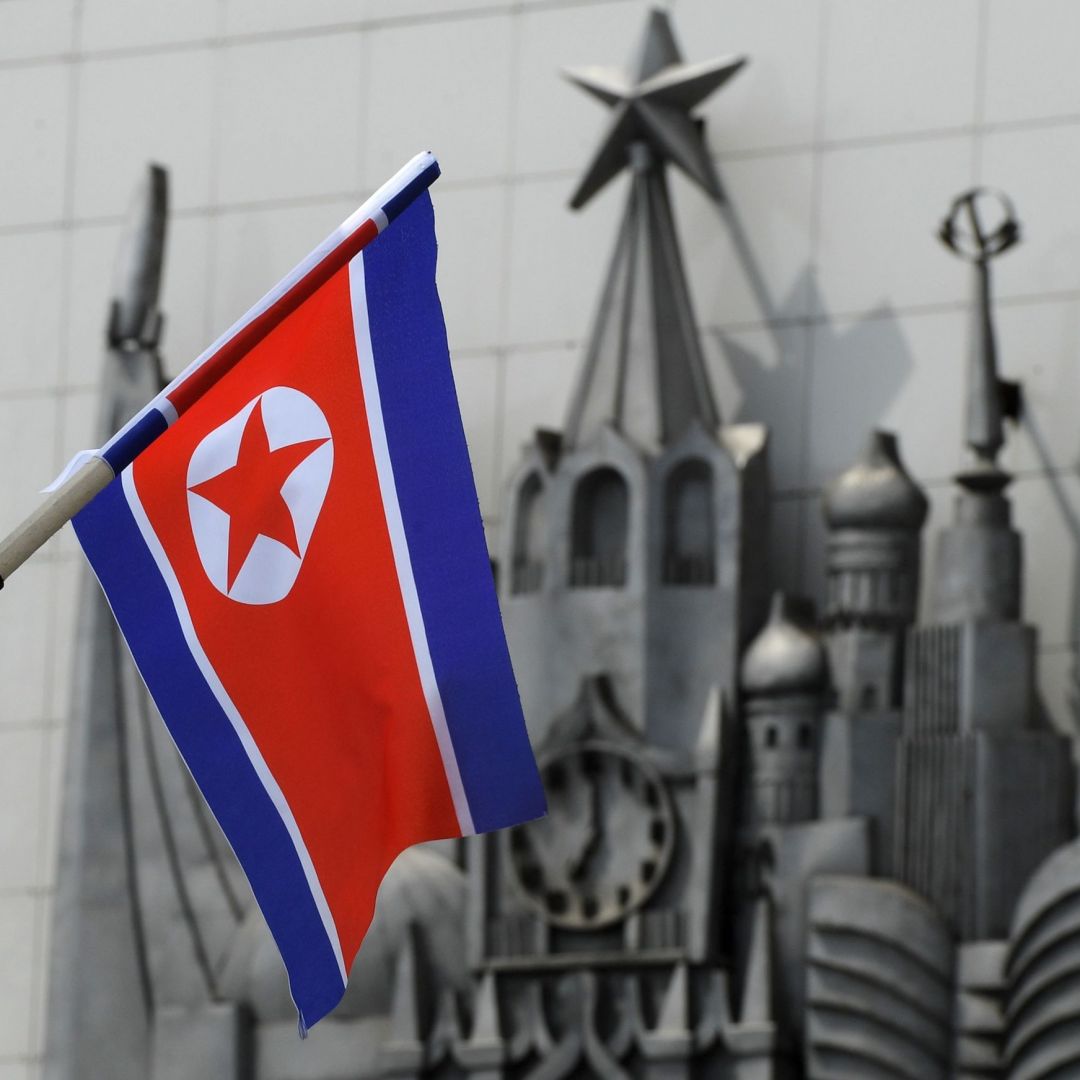 A North Korean flag is seen fixed on a lamp post in the far-eastern Russian port of Vladivostok on April 25, 2019. 