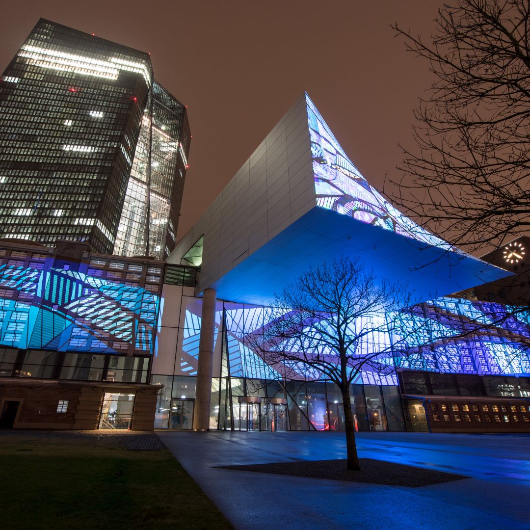 The historic facade of Frankfurt's Grossmarkthalle, now part of the building of the European Central Bank (ECB), is illuminated on March 16, 2018.