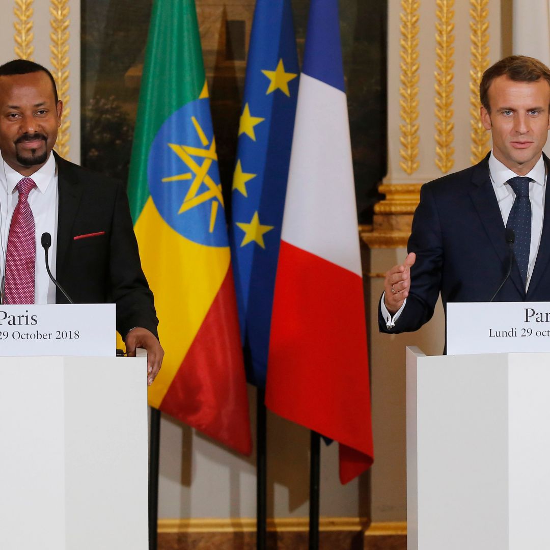 French President Emmanuel Macron gestures during a news conference with Ethiopian Prime Minister Abiy Ahmed in Paris on Oct. 29, 2018.