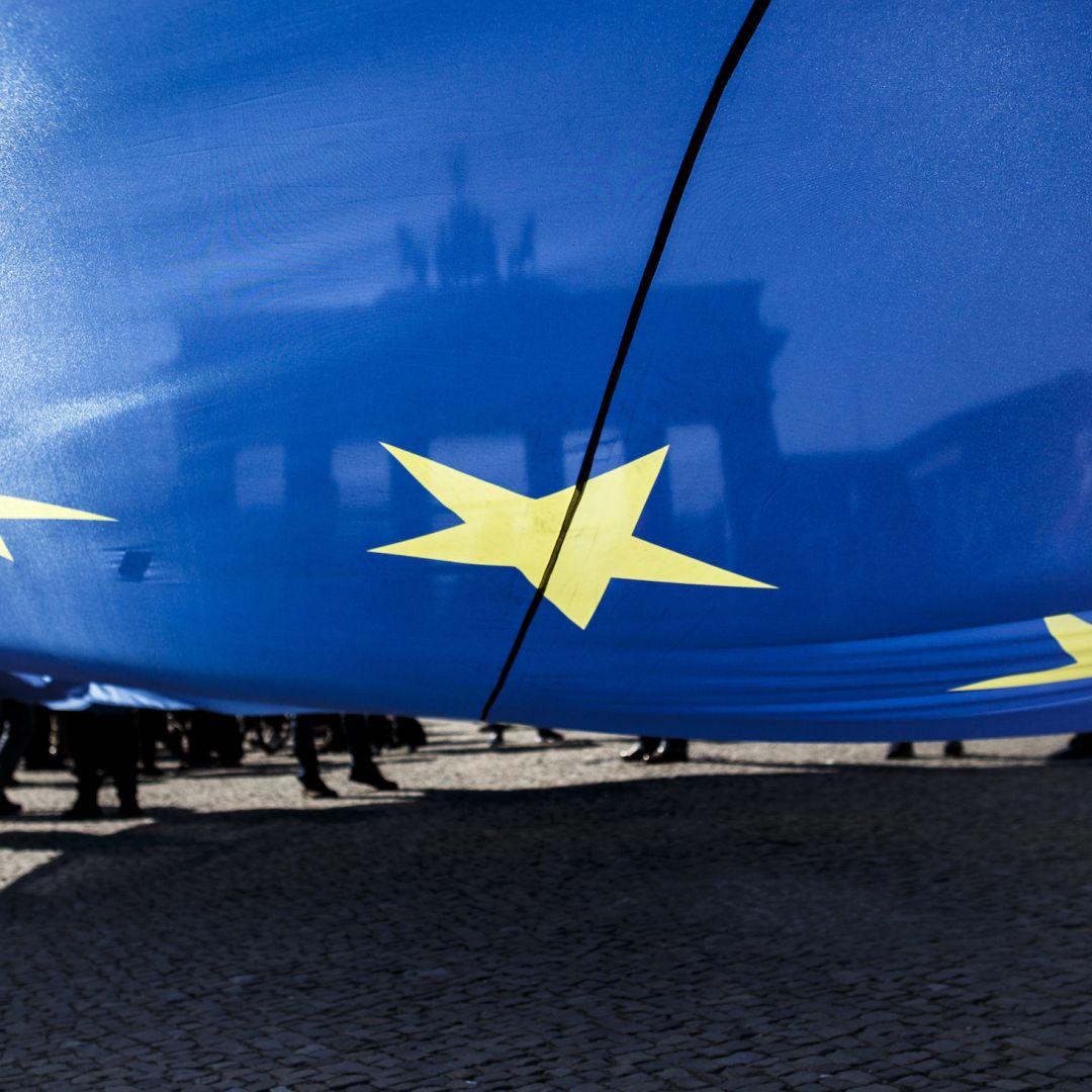 Supporters of the pro-EU movement Pulse of Europe wave EU flags as they gather in front of Berlin's Brandenburg Gate on April 8. 