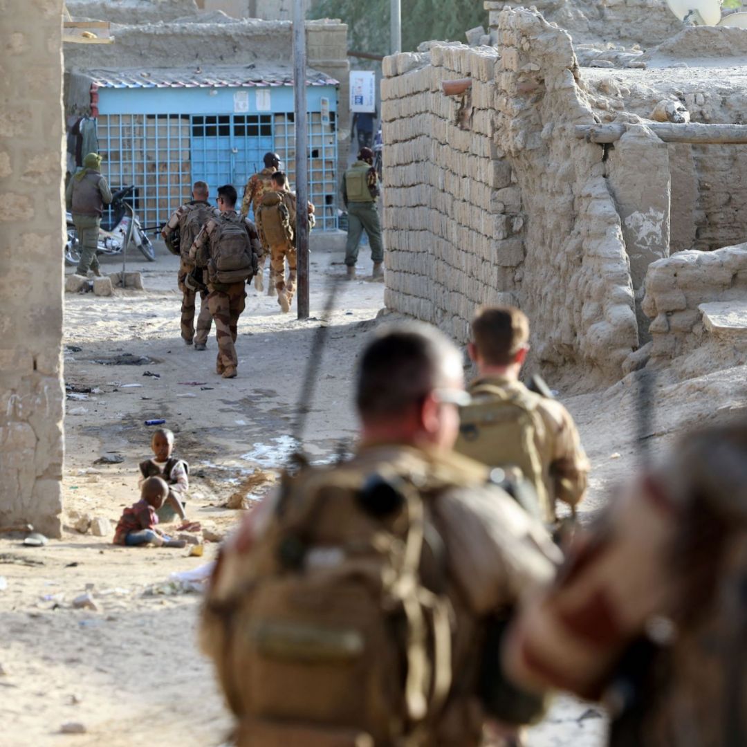 French soldiers of the Barkhane force patrol the streets of Timbuktu, Mali, on Dec. 5, 2021.