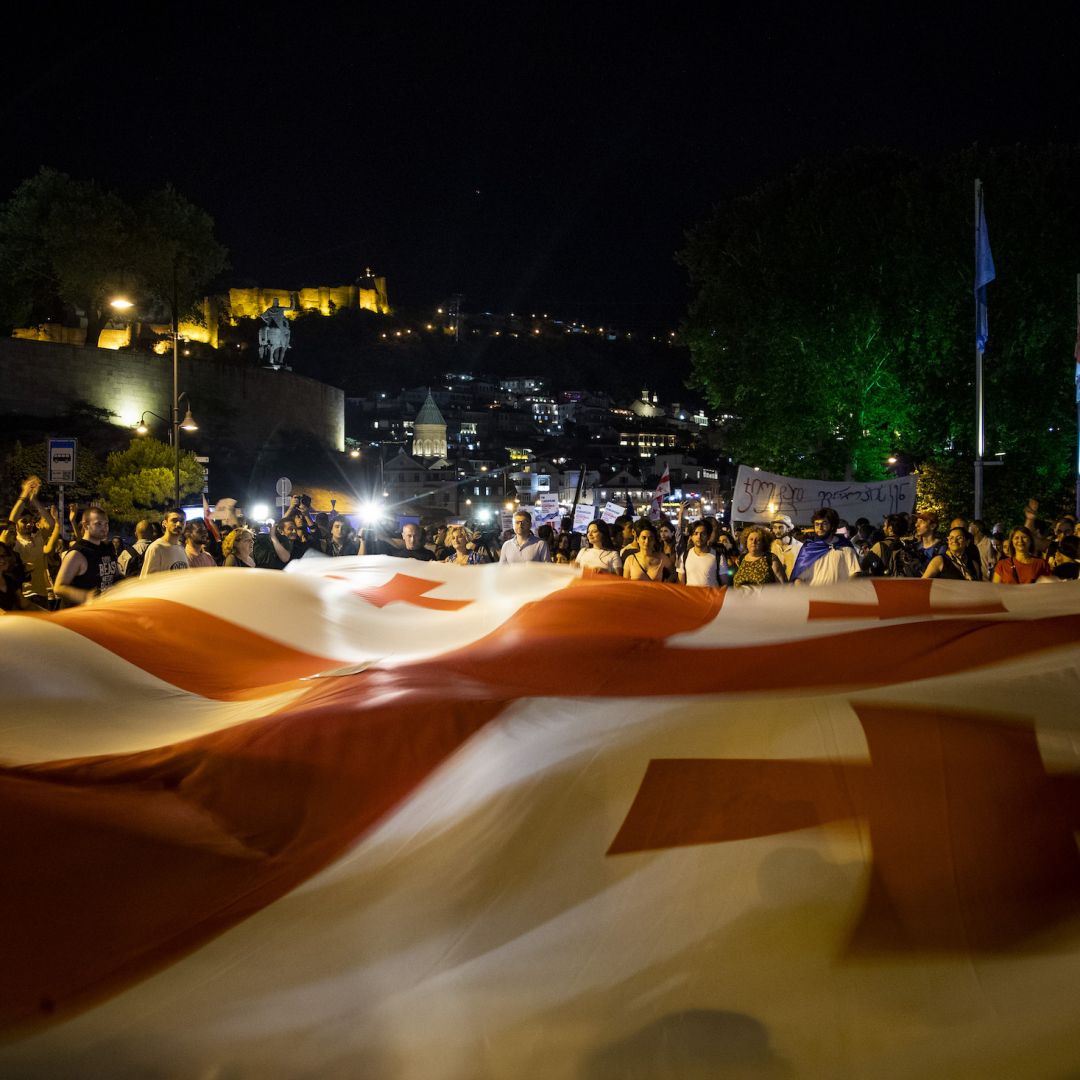 Demonstrators wave a flag of Georgia in Europe Square on June 20, 2022 in Tbilisi, Georgia.