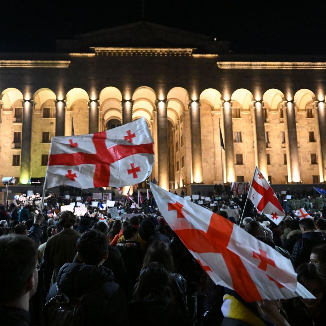 Georgian opposition supporters gather outside the parliament in Tbilisi on March 9, 2023, ahead of a vote on the ruling party's controversial ''foreign agent'' bill. 