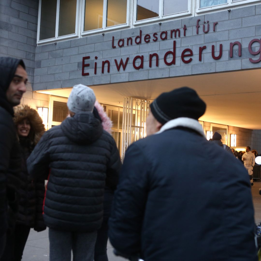 Foreigners wait outside the immigration office in Berlin, Germany, for assistance in regulating their legal residency status on Feb. 6, 2020.