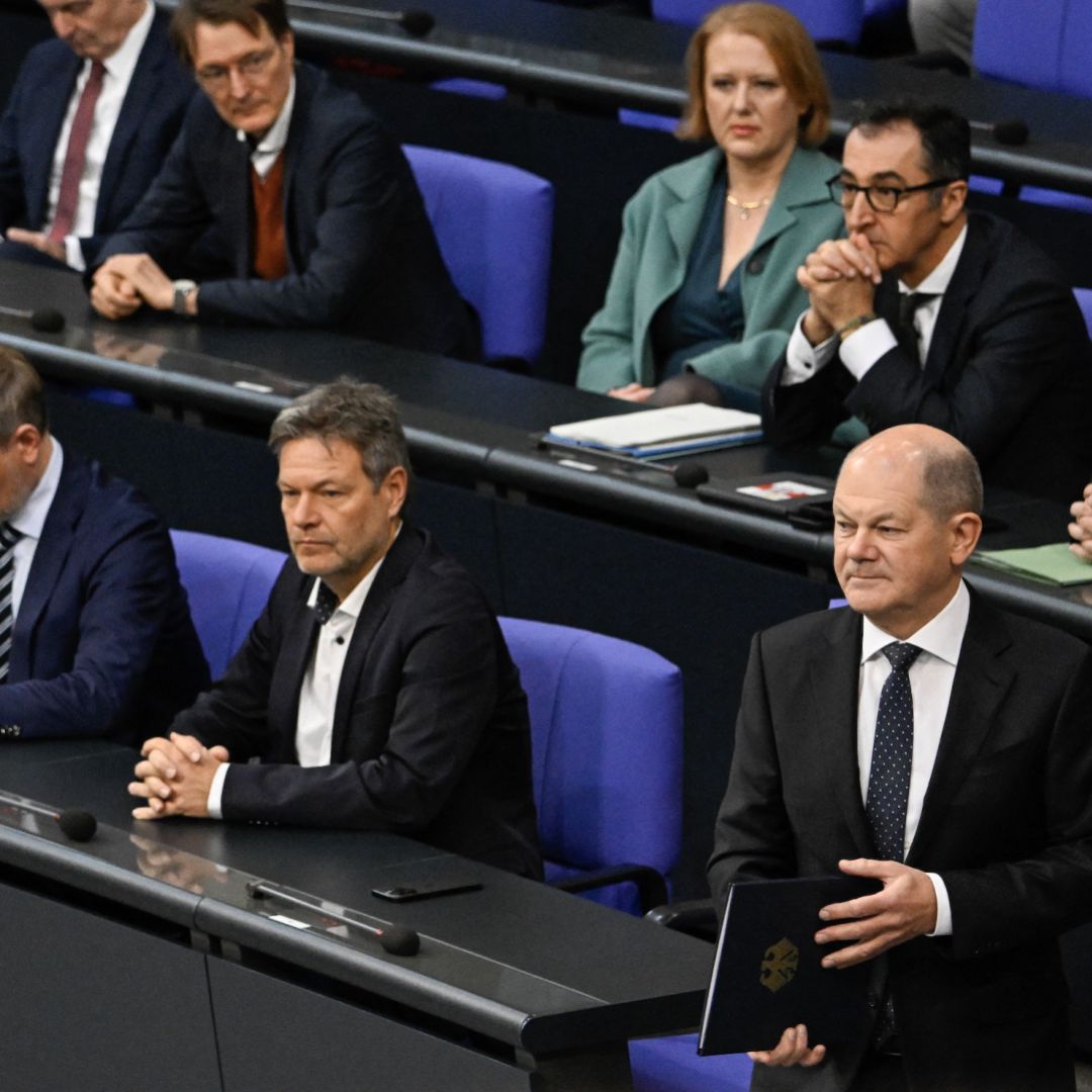 German Chancellor Olaf Scholz prepares to deliver a speech in parliament about the budget crisis on Nov. 28, 2023, as Interior Minister Nancy Faeser (left), Finance Minister Christian Lindner and Economy Minister Robert Habeck look on. German Chancellor Olaf Scholz prepares to deliver a speech in parliament about the budget crisis on Nov. 28, 2023, as Interior Minister Nancy Faeser (left), Finance Minister Christian Lindner and Economy Minister Robert Habeck look on.