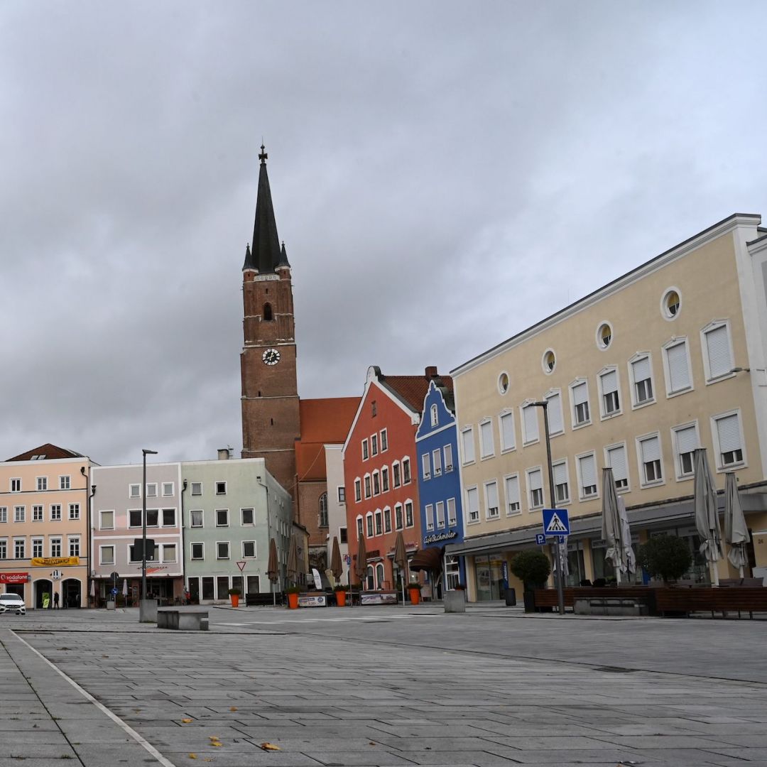 A photo shows an empty plaza with closed stores in the German city of Eggenfelden on Oct. 27, 2020, after a local lockdown was imposed to contain the spread of COVID-19. A photo shows an empty plaza with closed stores in the German city of Eggenfelden on Oct. 27, 2020, after a local lockdown was imposed to contain the spread of COVID-19.