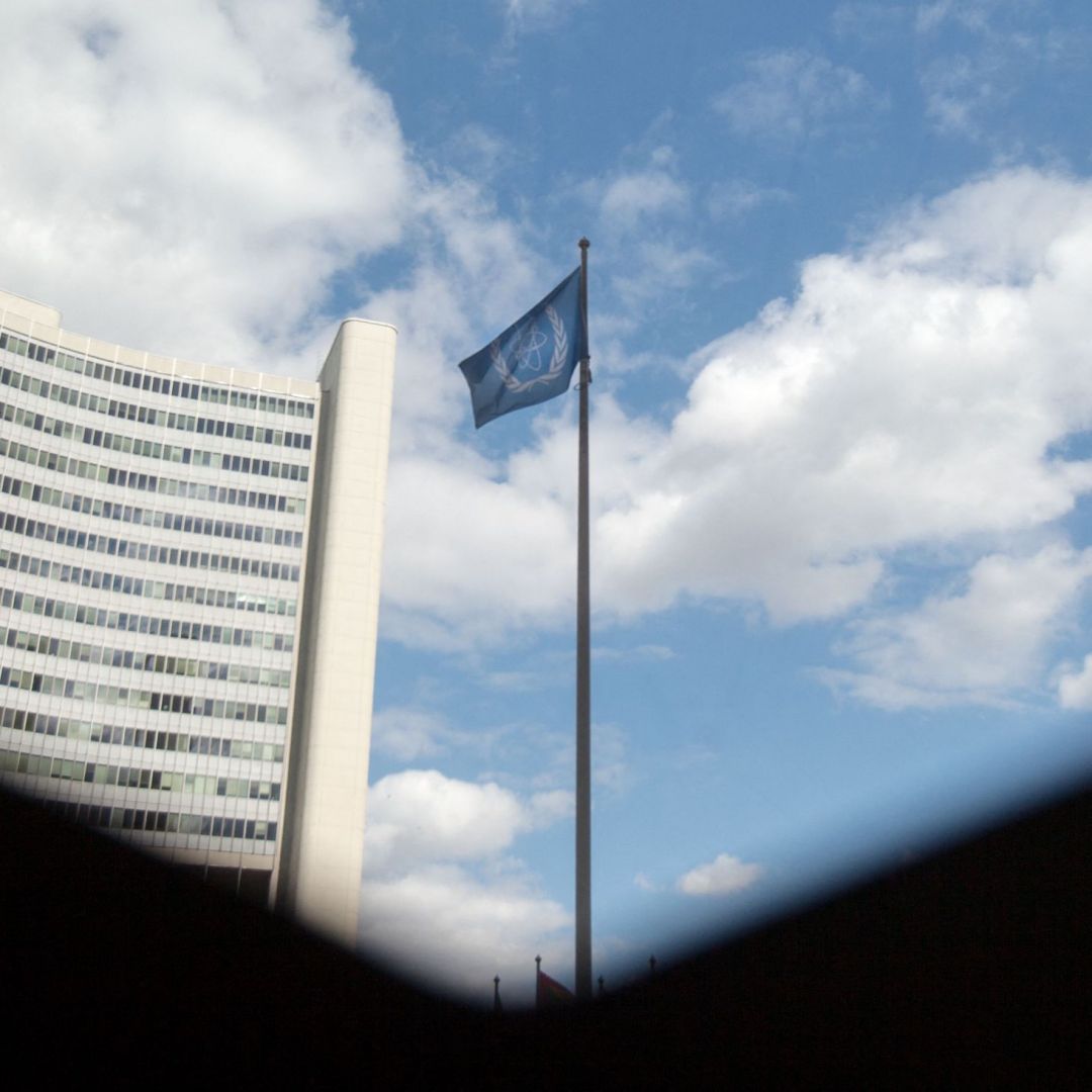 The flag of the International Atomic Energy Agency (IAEA) flutters in front of the IAEA building in Vienna, Austria, on July 10, 2019.