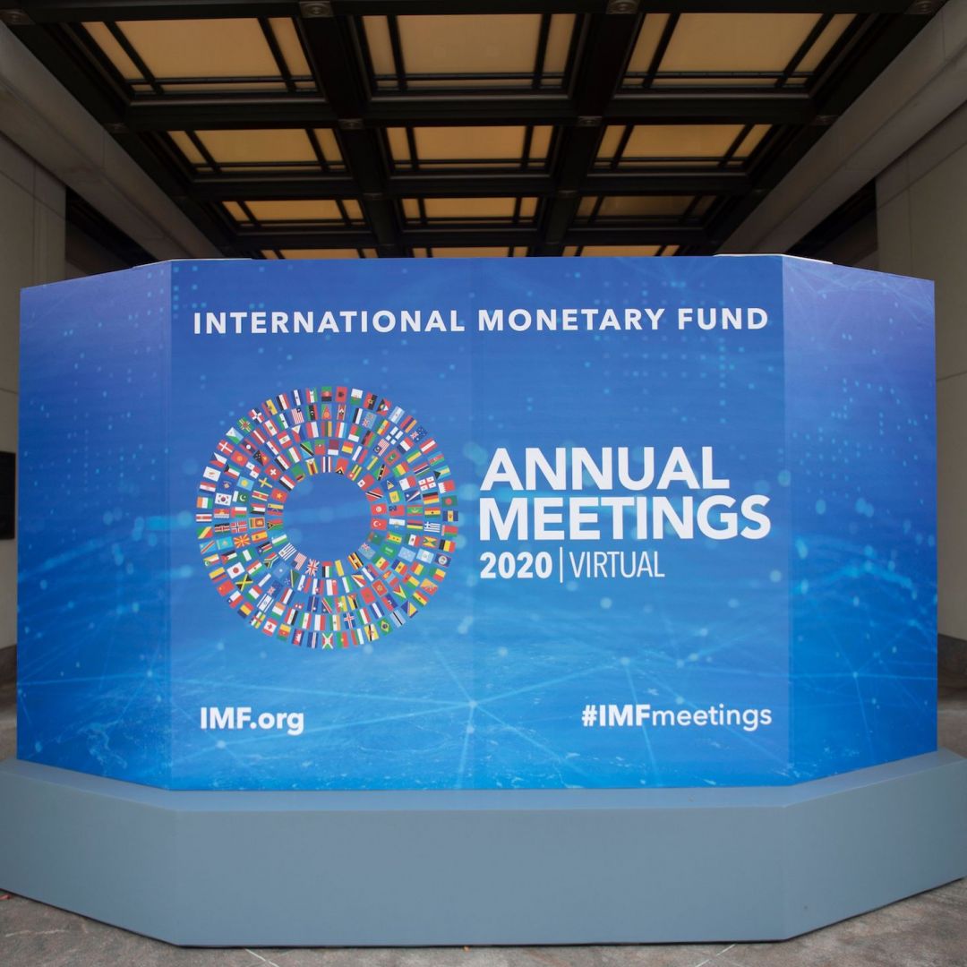 A promotional board for the annual series of meetings between the International Monetary Fund (IMF) and the World Bank is seen outside the IMF headquarters in Washington D.C. on Oct. 13, 2020.
