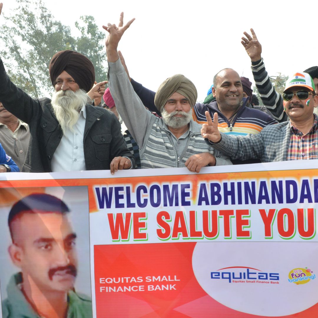 Indians wait for Pakistani officials to hand over a captured Indian pilot at the border crossing near Wagah, Pakistan, on March 1, 2019.