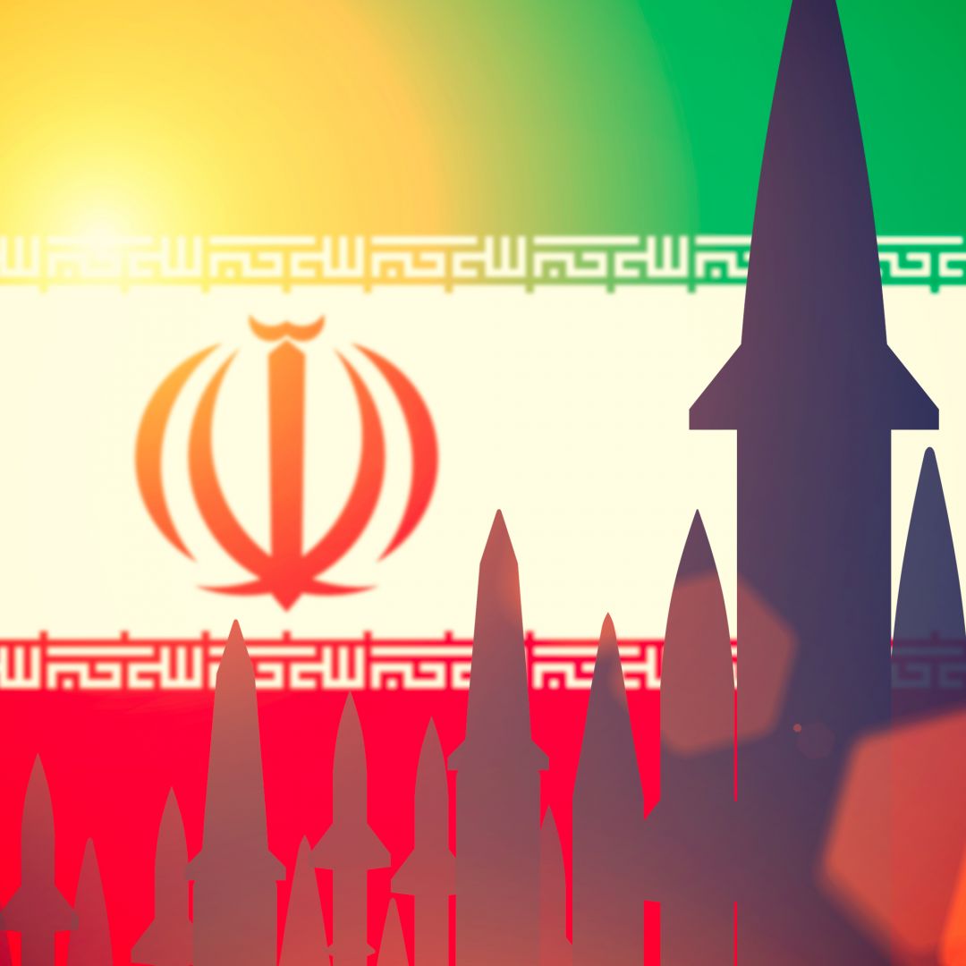 A digital illustration shows missiles overlapping the Iranian flag. 