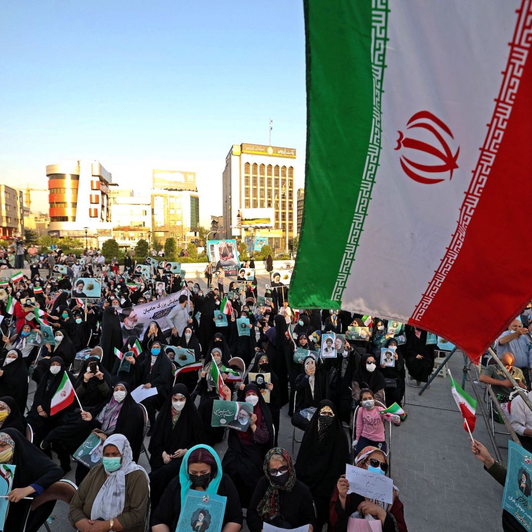 Supporters of Iranian presidential candidate Ebrahim Raisi attend an election campaign June 14, 2021 in Tehran. Supporters of Iranian presidential candidate Ebrahim Raisi attend an election campaign June 14, 2021 in Tehran.