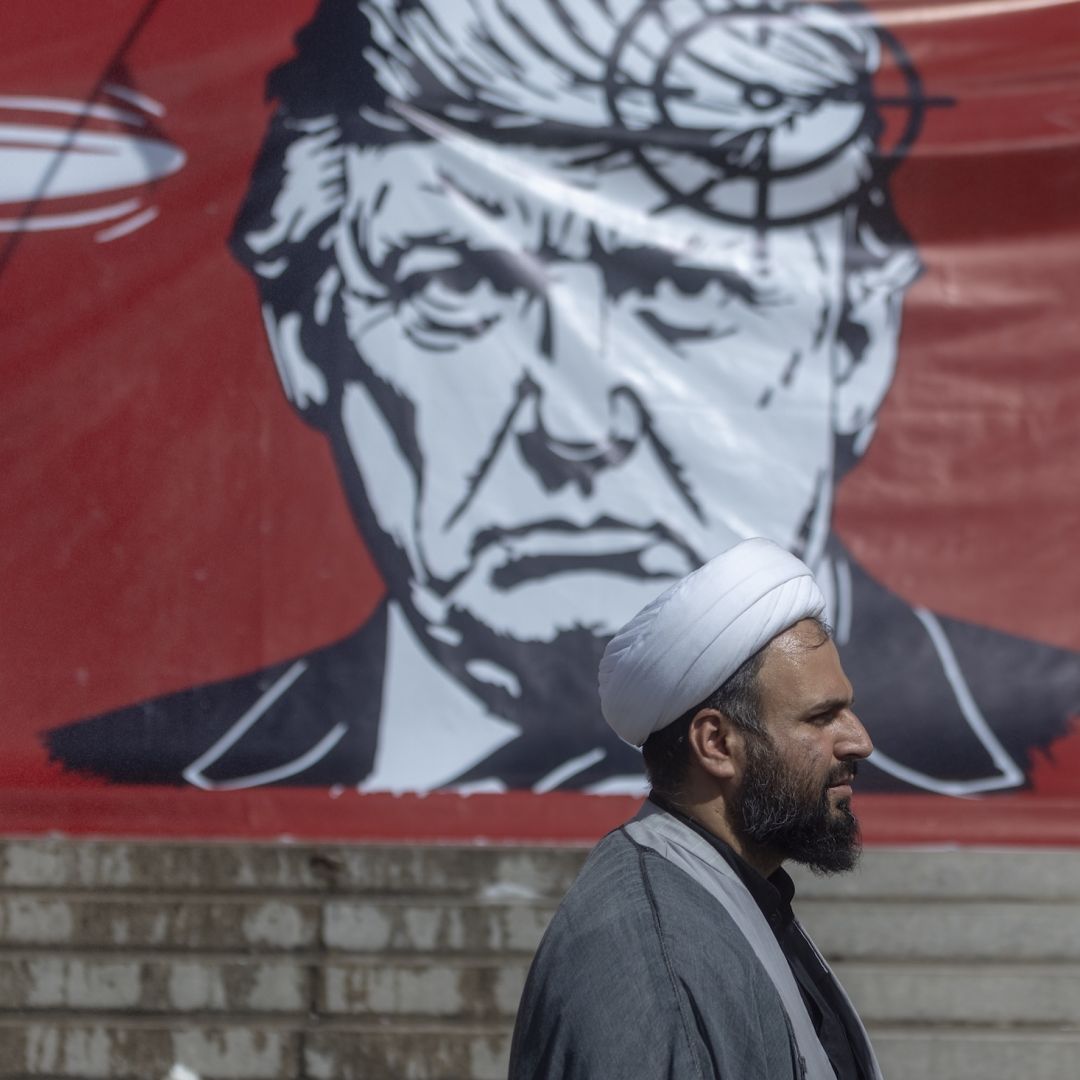 People pass a large banner depicting U.S. President Donald Trump with a target on his head, during funeral ceremonies for Iran's slain Supreme Leader, Ayatollah Ali Khamenei, at the Grand Mosalla on July 5 in Tehran, Iran. People pass a large banner depicting U.S. President Donald Trump with a target on his head, during funeral ceremonies for Iran's slain Supreme Leader, Ayatollah Ali Khamenei, at the Grand Mosalla on July 5 in Tehran, Iran.
