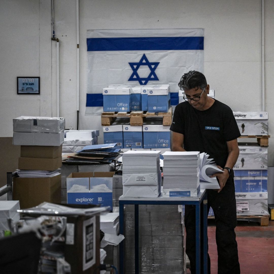 A photo taken on Nov. 5, 2023, shows a man working at a printing factory in southern Israel that recently resumed business following Hamas' Oct. 7 assault. 