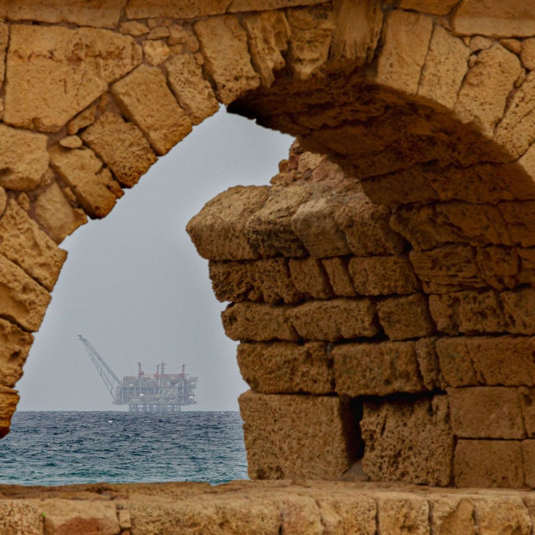 The platform in the Leviathan natural gas field in the Mediterranean Sea is pictured through an arcade in the Israeli northern coastal city of Caesarea on Feb. 24, 2022. 