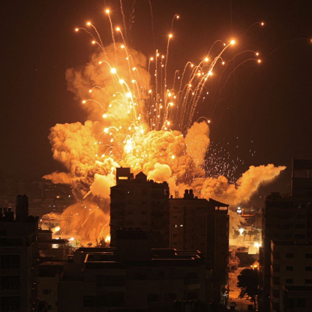 A missile explodes over Gaza City during an Israeli air strike on Oct. 8, 2023. A missile explodes over Gaza City during an Israeli air strike on Oct. 8, 2023.