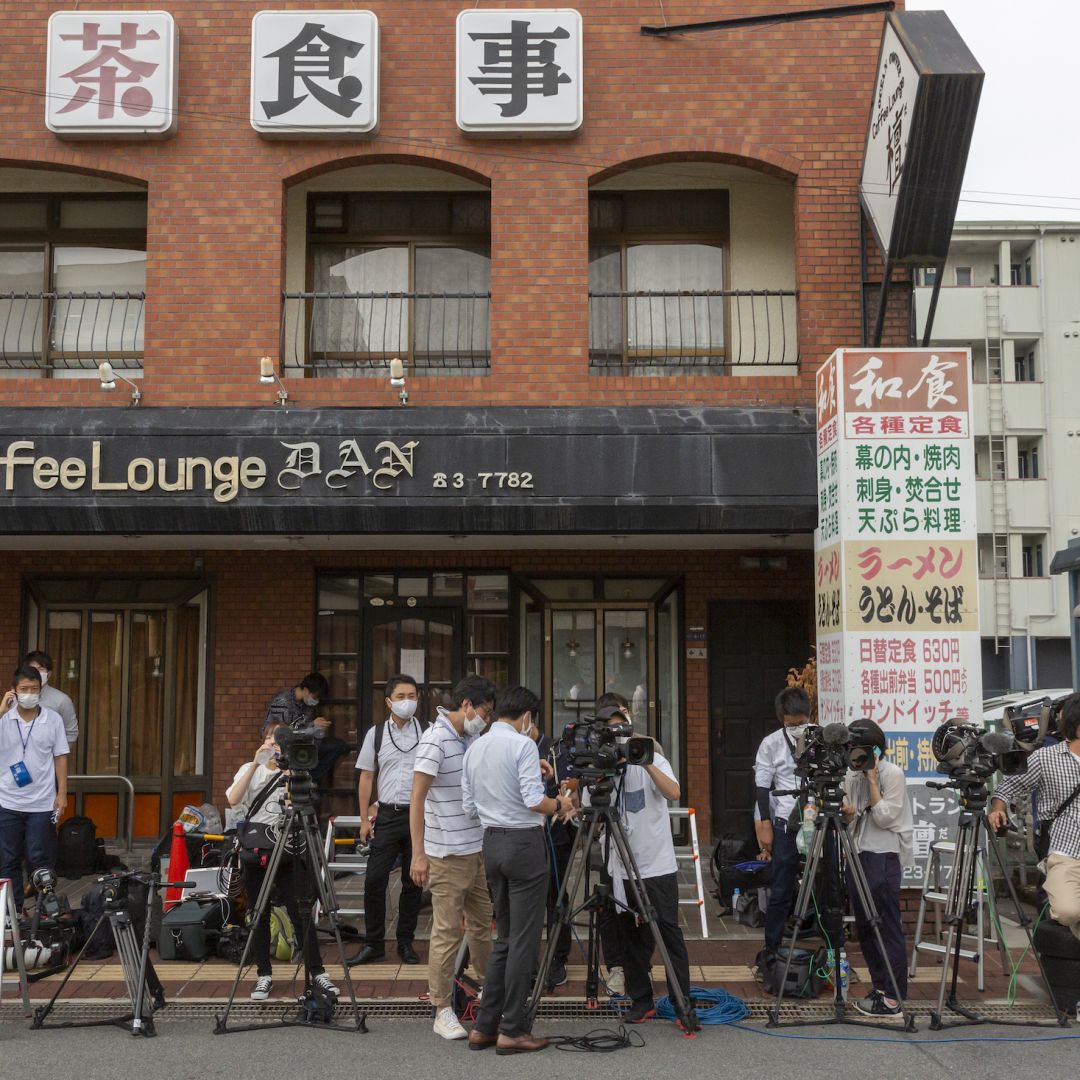 Media members near the hospital where former Japanese Prime Minister Shinzo Abe was transferred after being fatally shot during an election rally July 8, 2022, in Nara, Japan. Media members near the hospital where former Japanese Prime Minister Shinzo Abe was transferred after being fatally shot during an election rally July 8, 2022, in Nara, Japan.