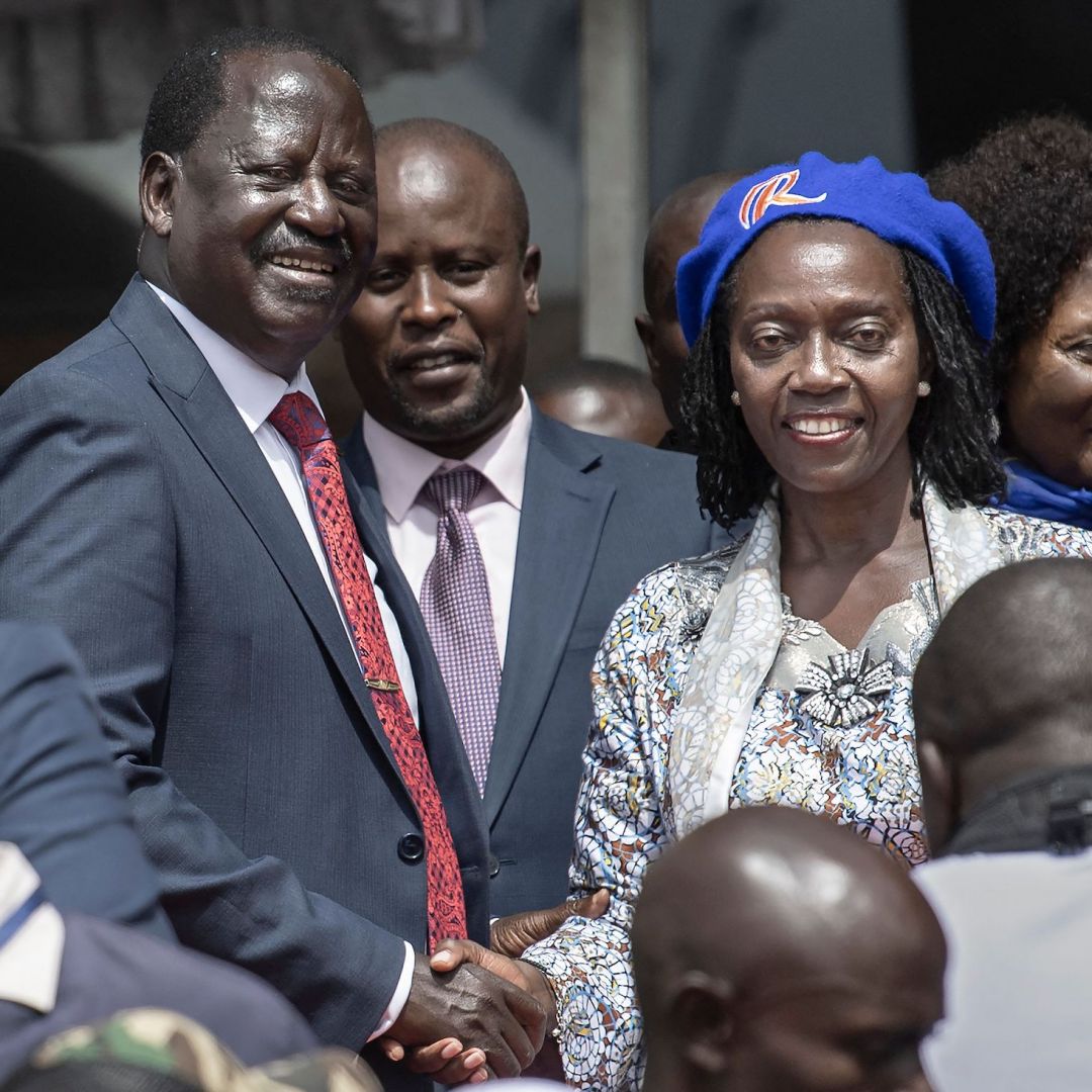 Raila Odinga (center left) shakes the hand of his newly announced running mate, Martha Karua, (center right), on May 16, 2022, in the Kenyan capital of Nairobi. Raila Odinga (center left) shakes the hand of his newly announced running mate, Martha Karua, (center right), on May 16, 2022, in the Kenyan capital of Nairobi.