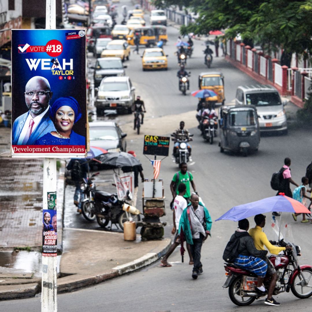 A campaign poster for Liberian President George Weah is seen above a street in Monrovia, Liberia, on Oct. 4, 2023. 