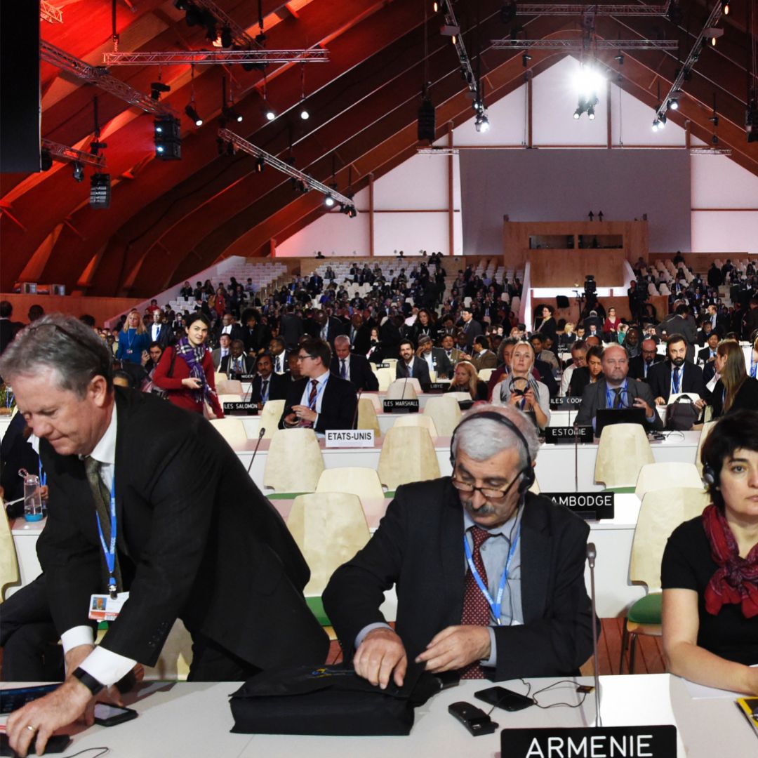 Delegates attend a plenary session at the U.N. climate change summit in Paris on Dec. 9.
