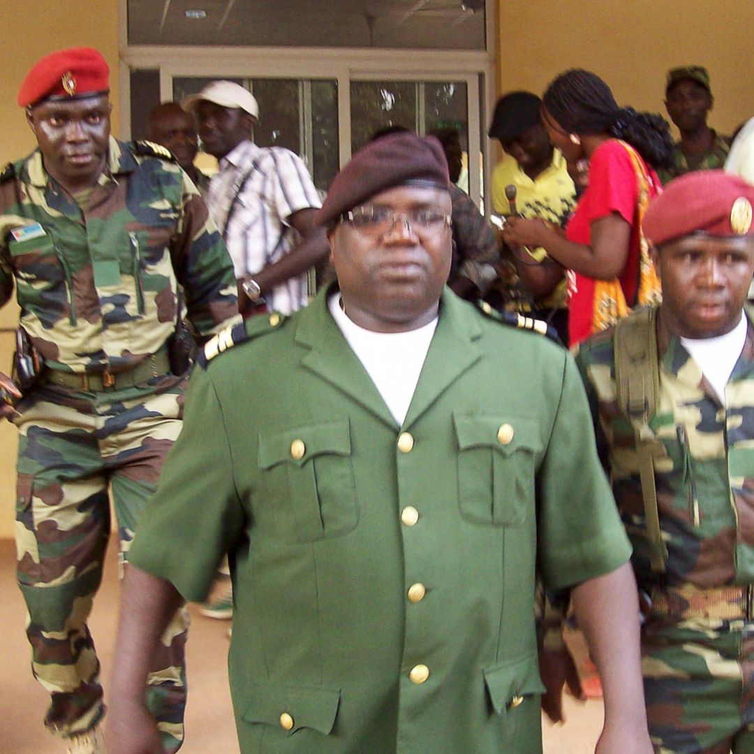 Military spokesman Dabana na Walna (C) of Guinea-Bissau walks with soldiers.