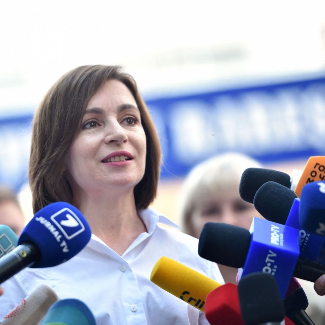 Moldovan President Maia Sandu speaks with journalists outside a polling station in Chisinau on July 11, 2021. Moldovan President Maia Sandu speaks with journalists outside a polling station in Chisinau on July 11, 2021.