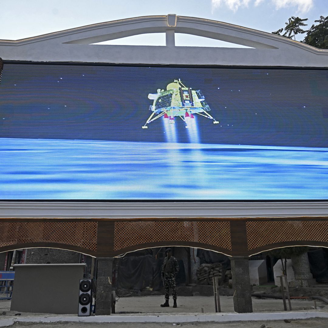 A paramilitary trooper in Srinagar, India, watches a live telecast of the Chandrayaan-3 spacecraft's lunar landing on Aug. 23, 2023. A paramilitary trooper in Srinagar, India, watches a live telecast of the Chandrayaan-3 spacecraft's lunar landing on Aug. 23, 2023.