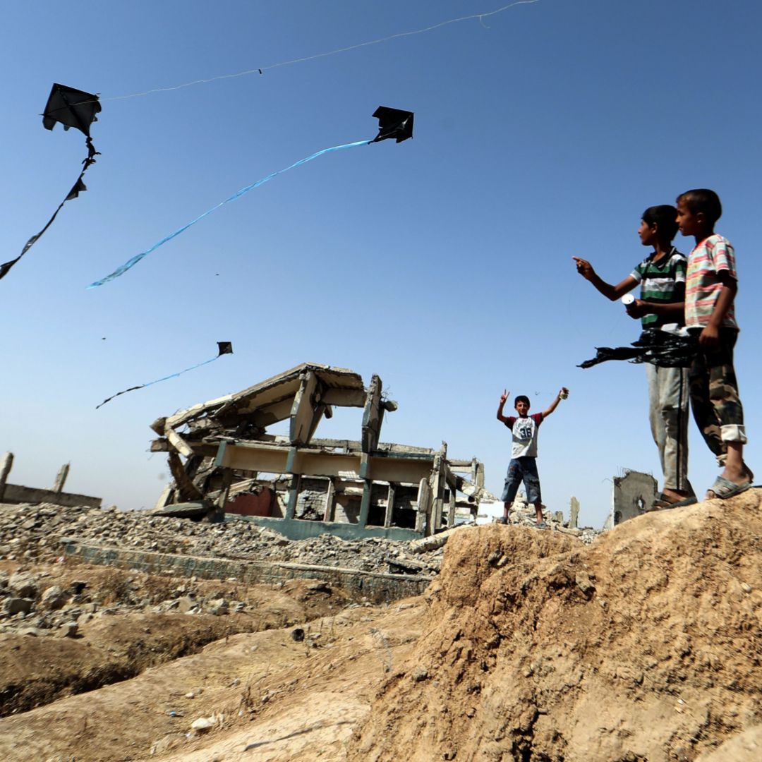 Iraqi children who were residents of Mosul play at a camp for displaced people. The damage left by the battle to retake the city from the Islamic State is typical of areas around the country, which are in need of rebuilding. Children who lived in Mosul play at their temporary home in a camp for people displaced from the war-scarred city.