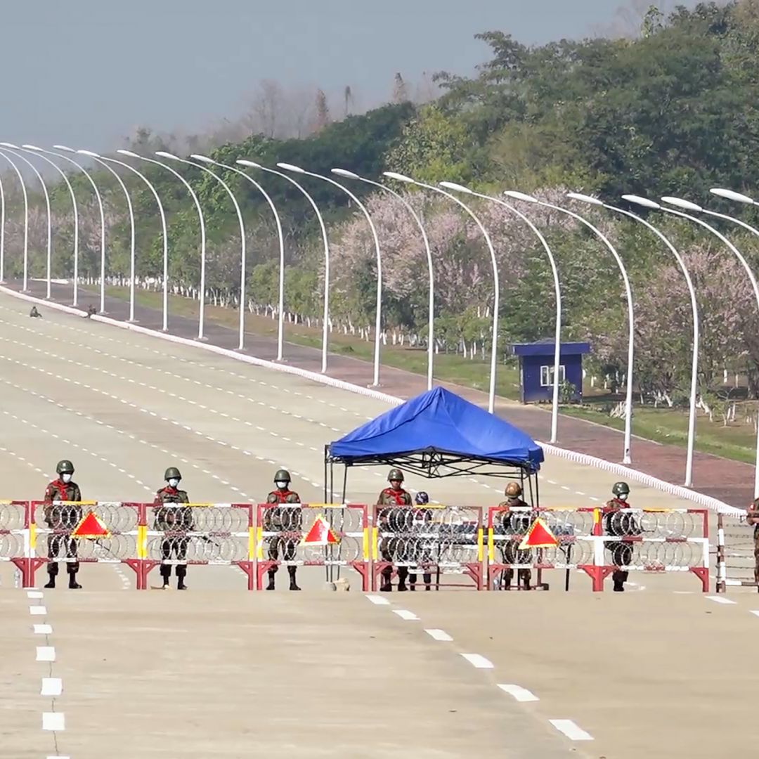 Soldiers stand guard on a blockaded road to Myanmar's parliament in Naypyidaw on Feb. 1, 2021, after the military detained the country's de facto leader and president in a coup. Soldiers stand guard on a blockaded road to Myanmar's parliament in Naypyidaw on Feb. 1, 2021, after the military detained the country's de facto leader and president in a coup.