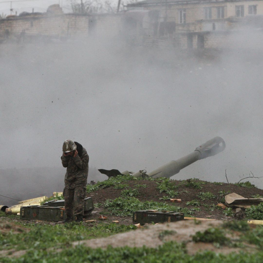 Armenian soldiers fire artillery shells toward Azeri forces in the town of Martakert, located in the disputed Nagorno-Karabakh region, on April 3, 2016. 